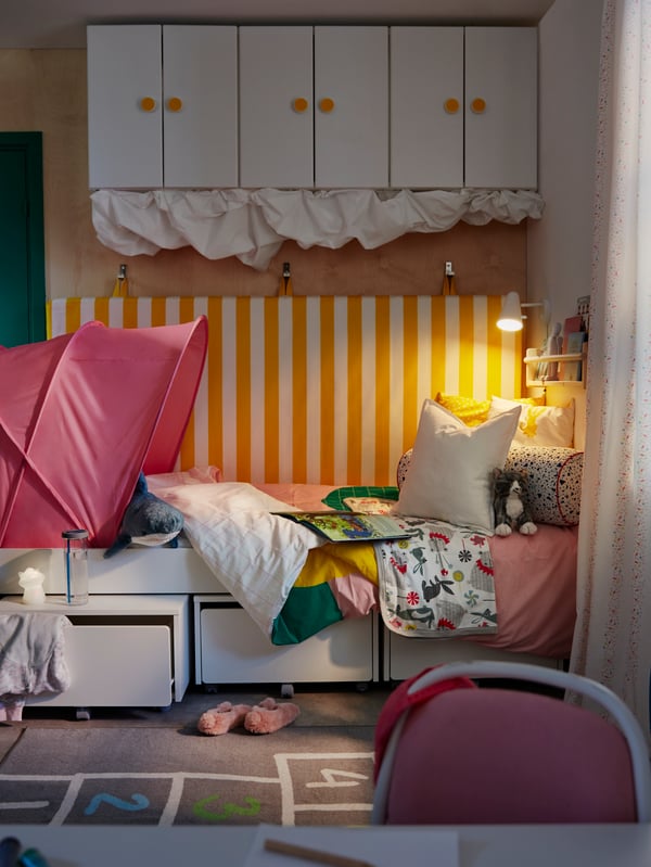 A pink SUFFLETT bed tent in the childrens room