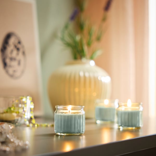 An Apple light green HÖKGÖK scented candle in glass in the dining room