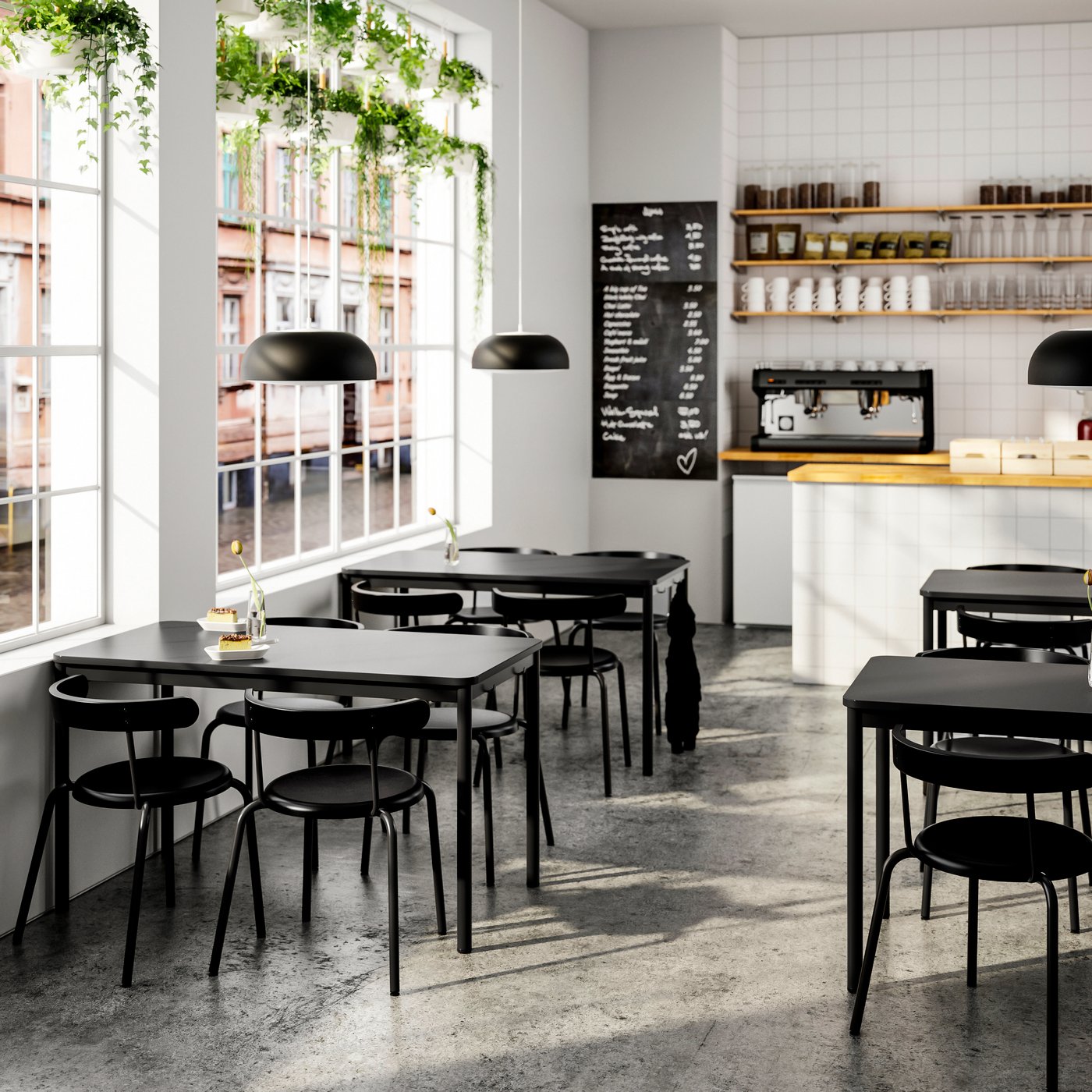 View into a coffee house with black tables and black YNGVAR chairs.