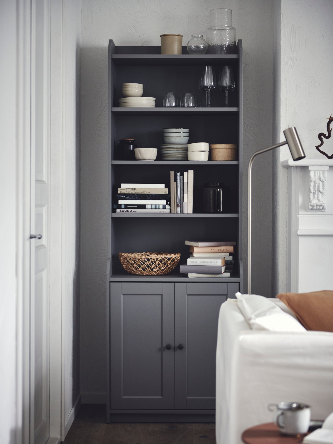 A grey HAUGA high cabinet with 2 doors