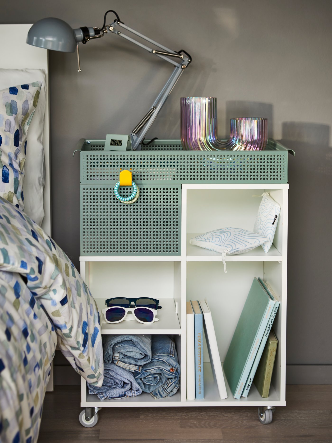 A white/grey-green ÖVNING trolley in children's room.
