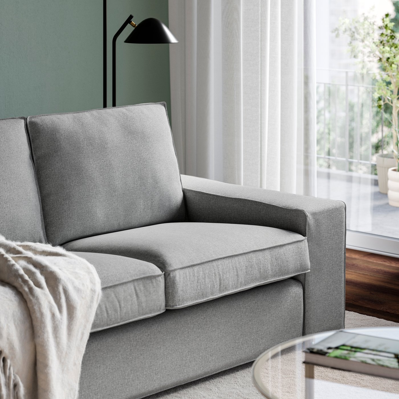 Ein KIVIK-Zweisitzer-Sofa in den Farben Tibbleby-Beige und Grau.