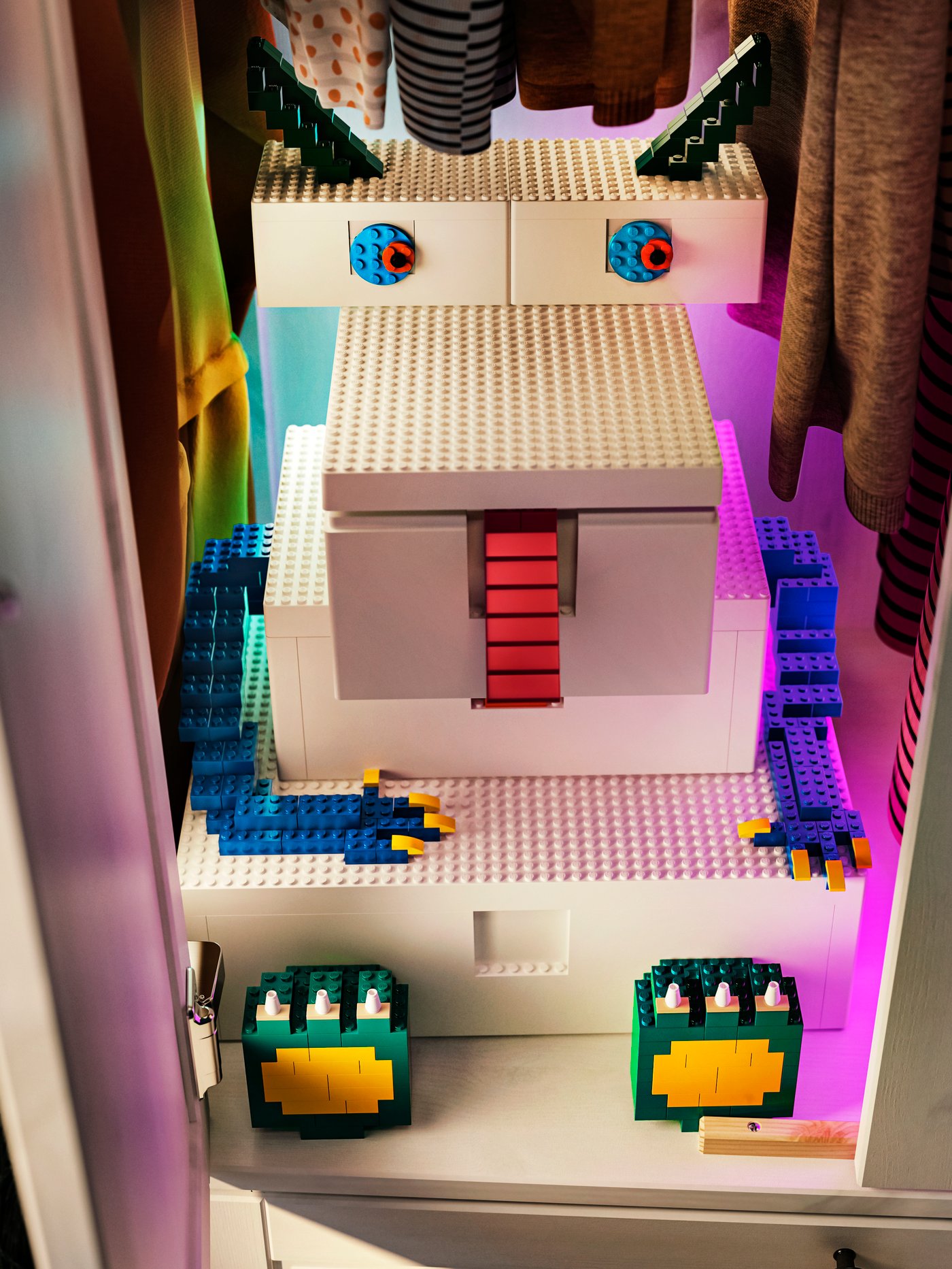 Five white BYGGLEK boxes of different sizes are built in the shape of a monster with extra LEGO bricks used for its features.