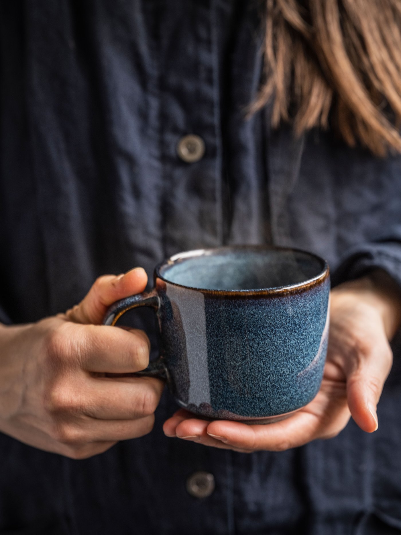 A blue GLADELIG mug