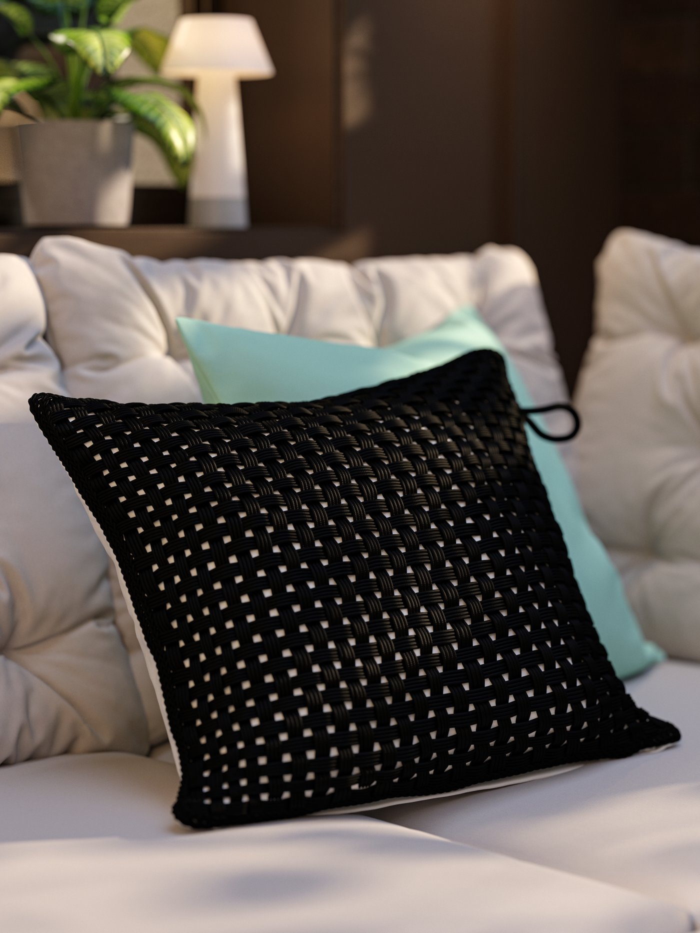 A patio with an outdoor corner sofa, grey-beige cushions and a pillow with a black outdoor/indoor TOFTÖ cushion cover.