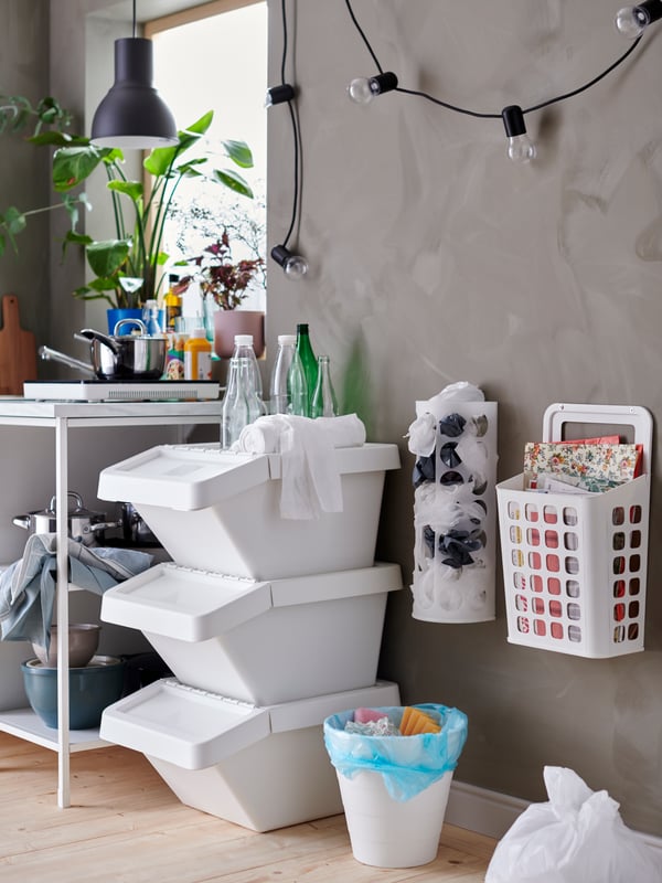 A white SORTERA waste sorting bin with lid in the kitchen