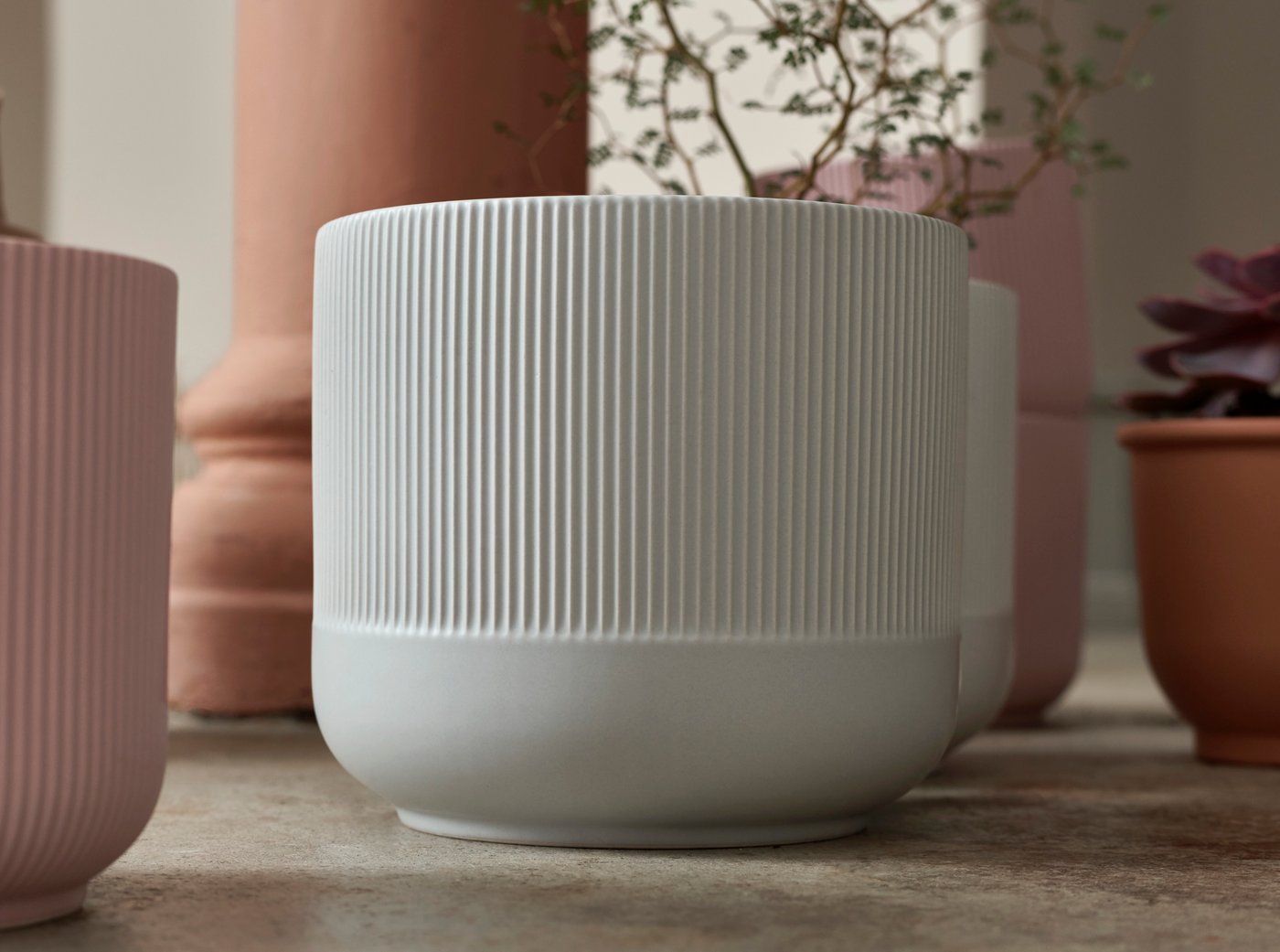 A grey GRADVIS plant pot