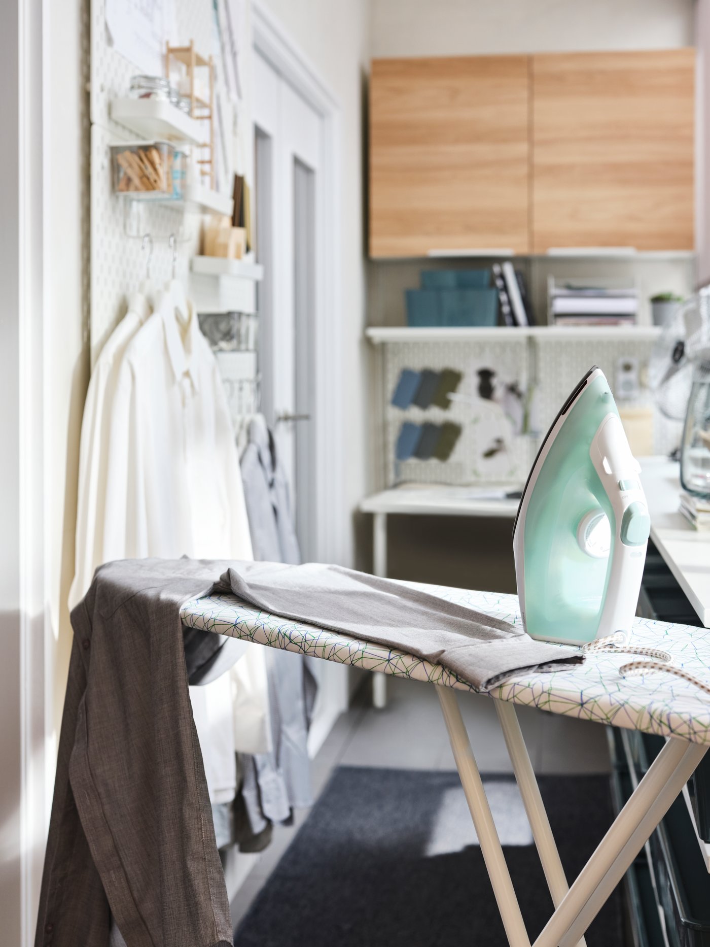 RUTER ironing board with iron and clothes 