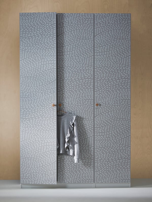 A white/grey patterned PAX wardrobe combination