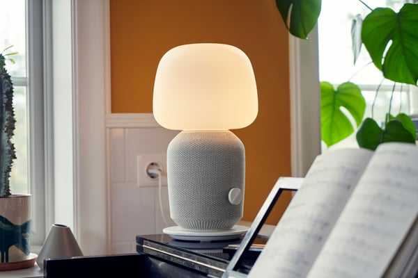 A white SYMFONISK table lamp with WiFi speaker
