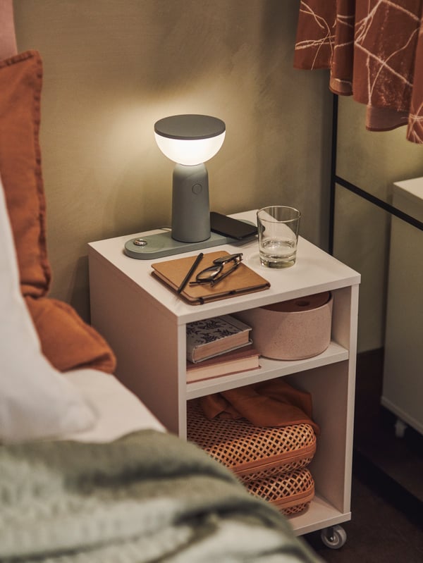 Lit BETTORP night lamp on a nightstand