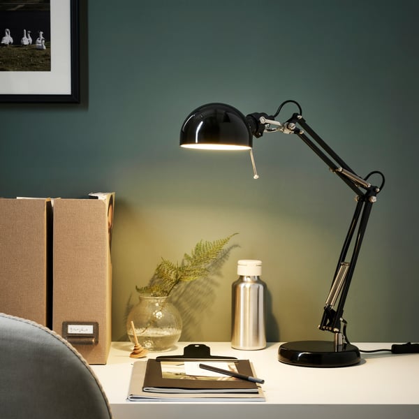 A black FORSÅ work lamp