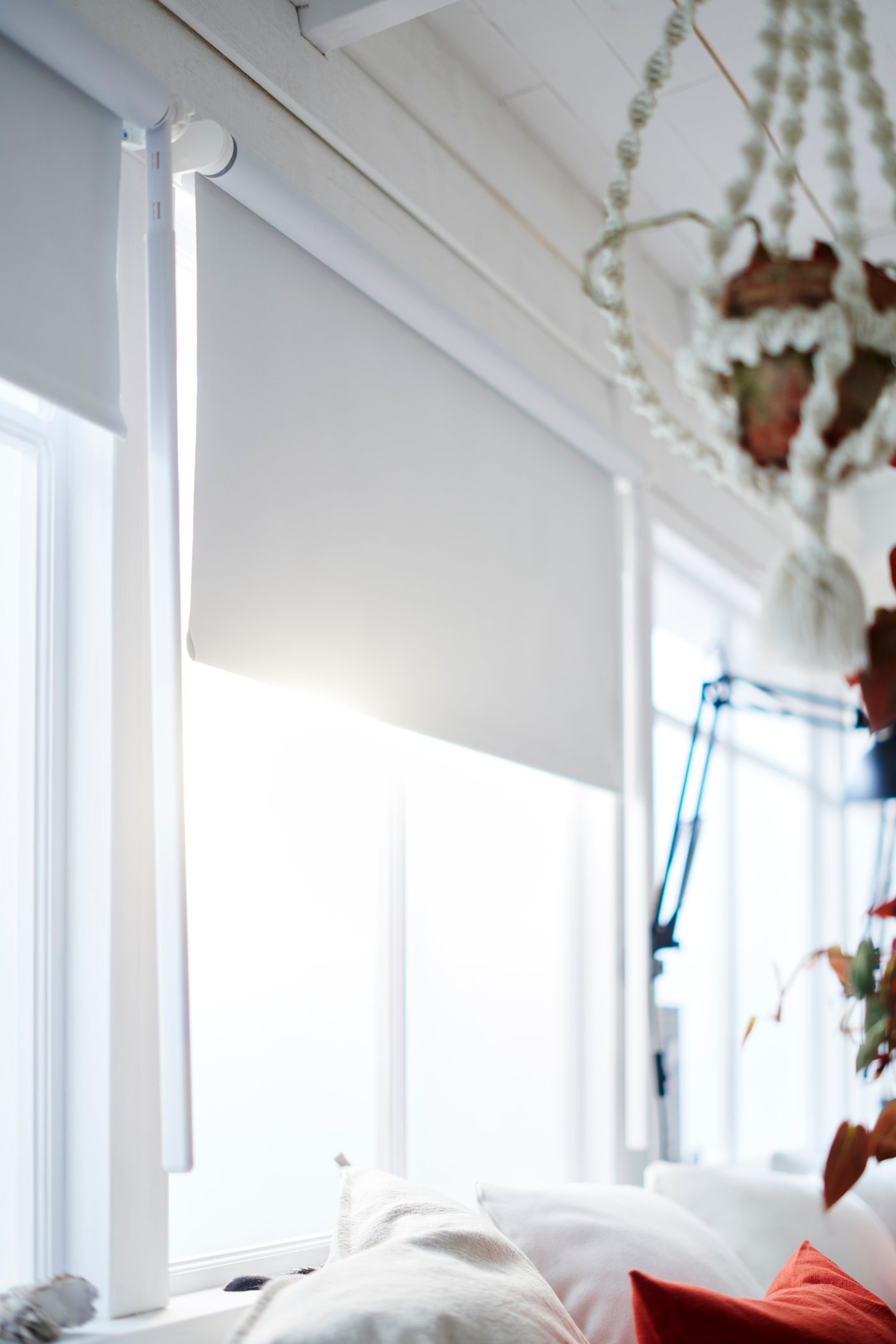 A white FRIDANS block-out roller blind