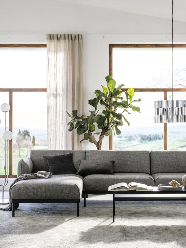A dark grey concrete effect/black NYBODA coffee table w reversible table top in the living room