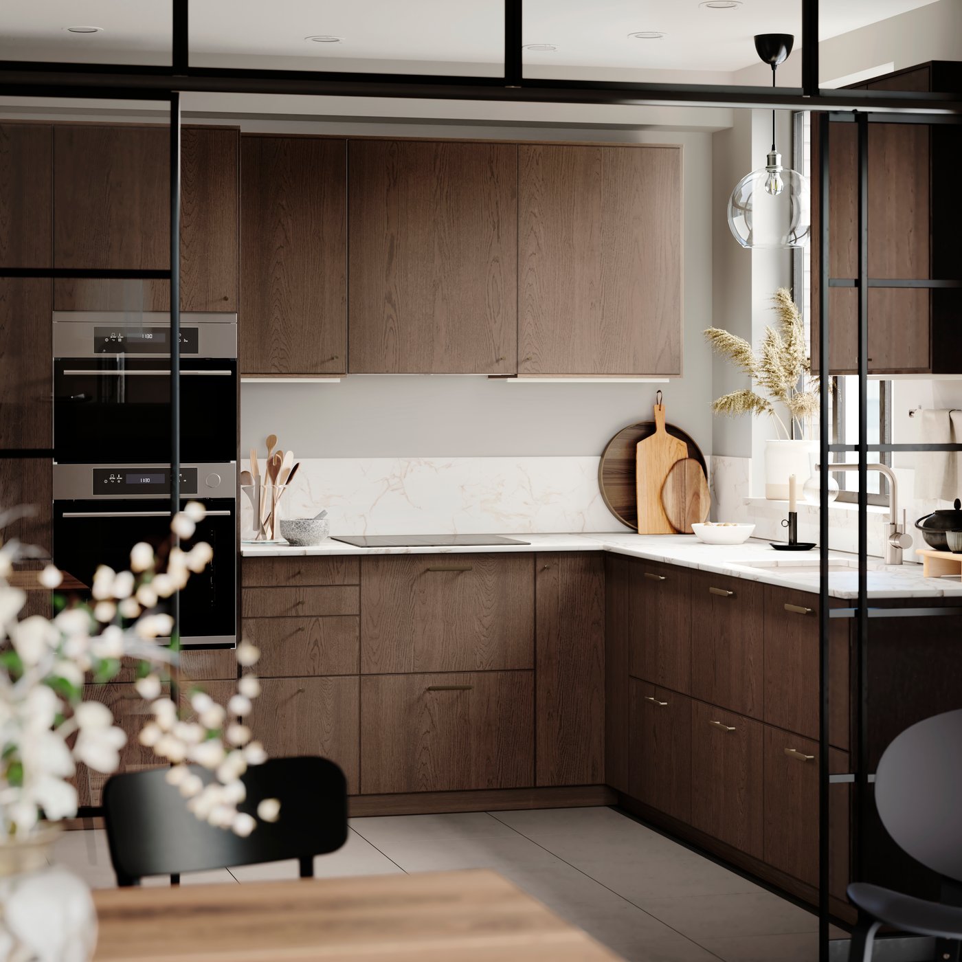 A brown wood finished kitchen with light countertops.