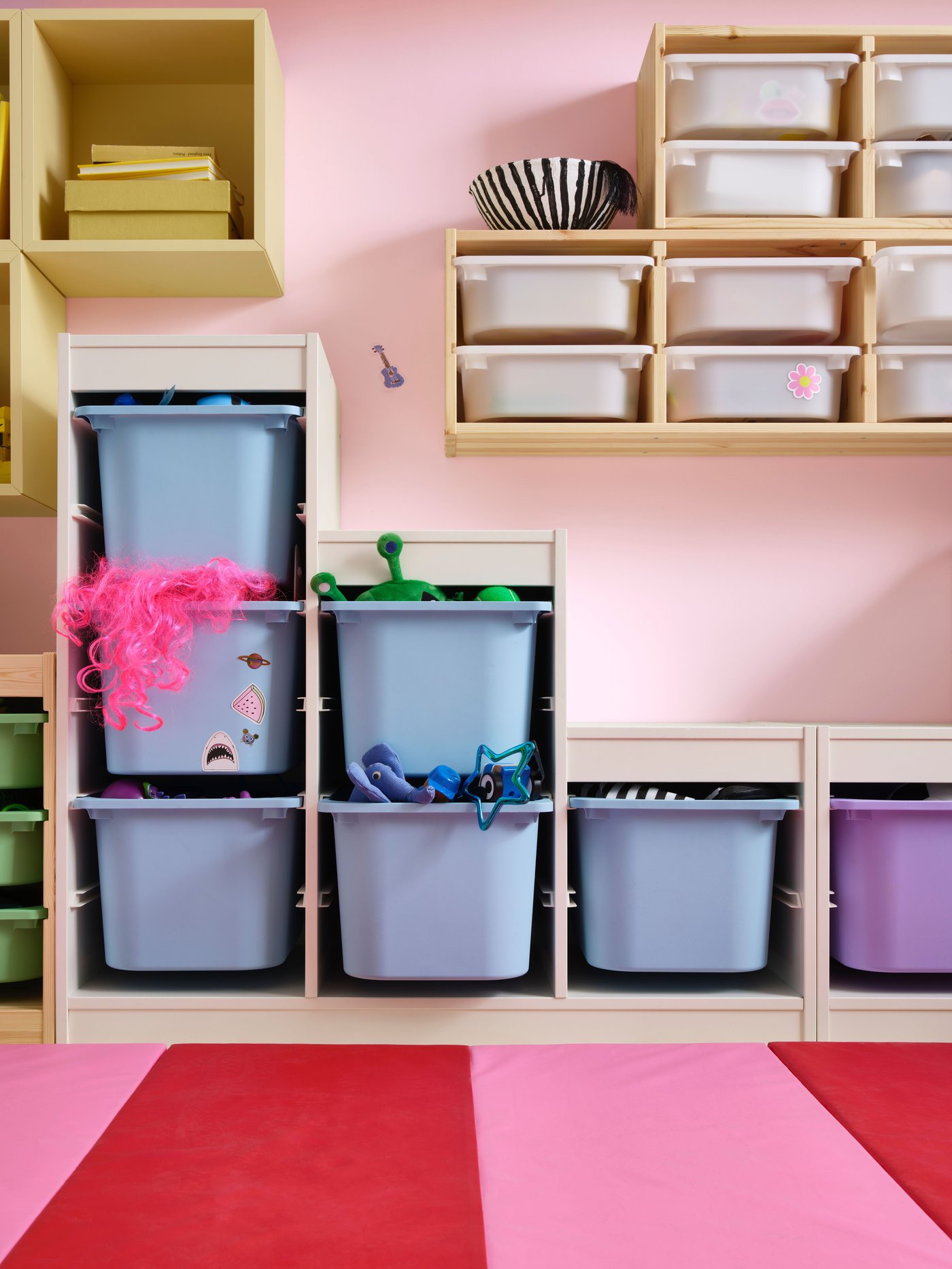 A light white stained pine TROFAST wall storage in the childrens room