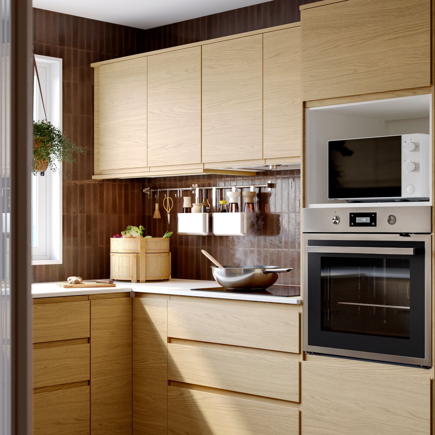 A kitchen with VOXTORP drawers fronts and doors in oak effect, ANRÄTTA forced air oven in stainless steel, baskets hanging. The kitchen comes with IKEA's 25-year guarantee.