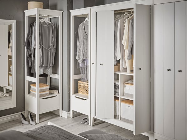 A white IDANÄS open wardrobe in the bedroom