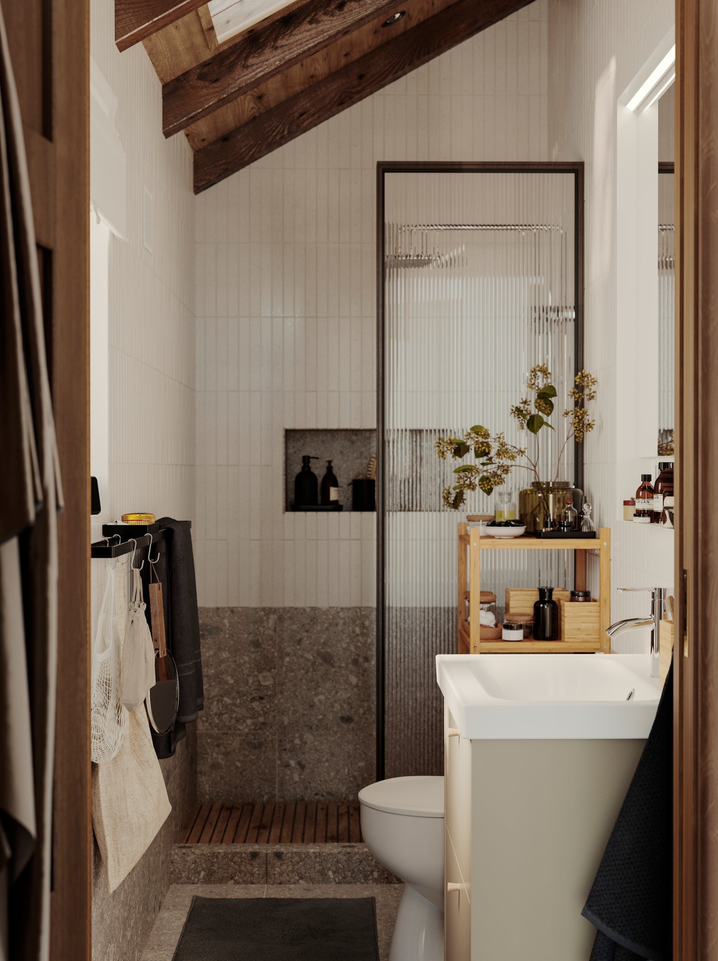 A small bathroom with a wooden ceiling has a shower wall, a beige HAVBÄCK wash-stand with drawers and a RÅGRUND shelf.