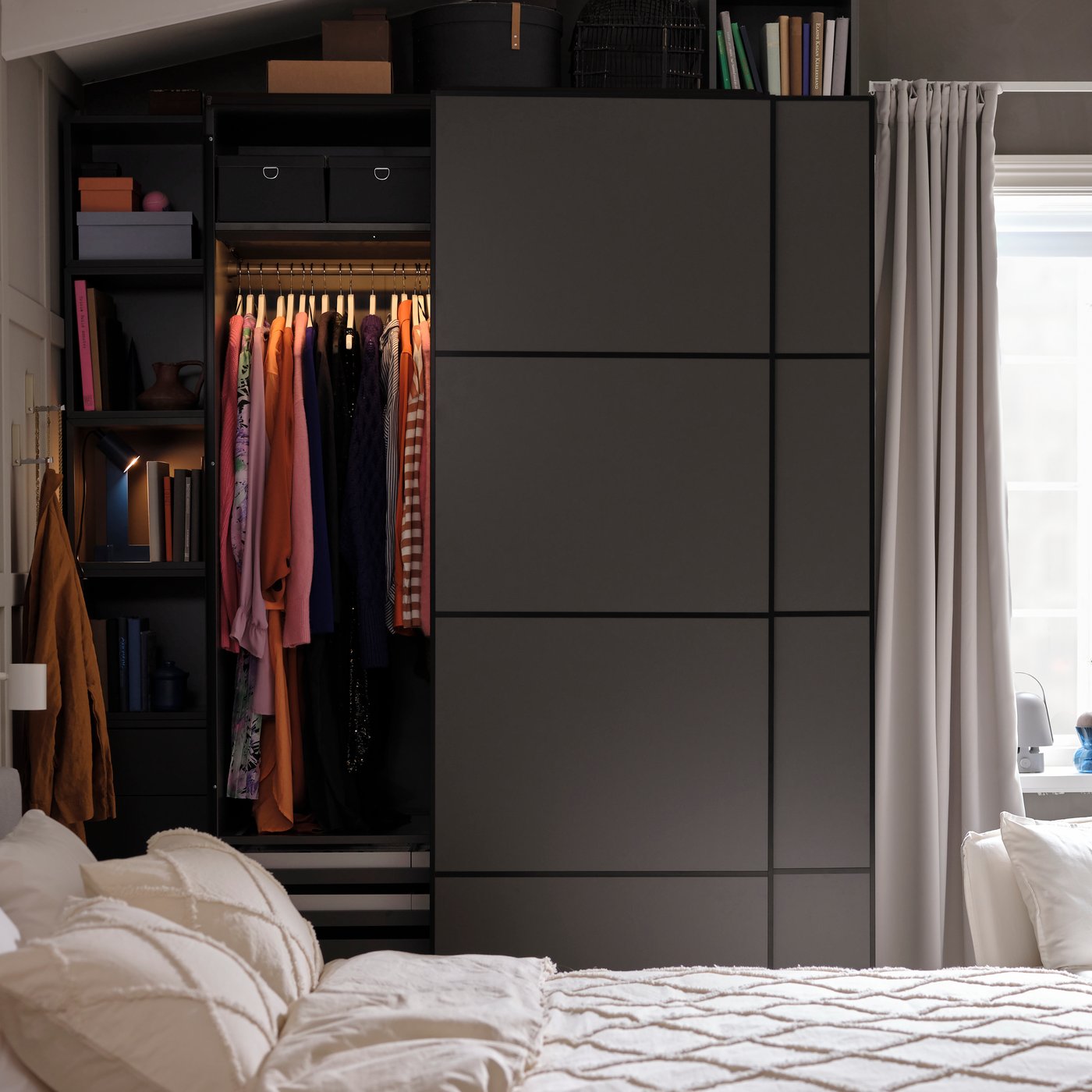 A dark grey/double sided dark grey PAX wardrobe combination