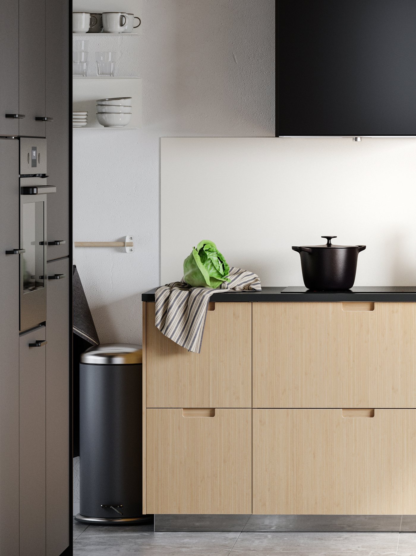 A dark grey MJÖSA pedal bin in the kitchen