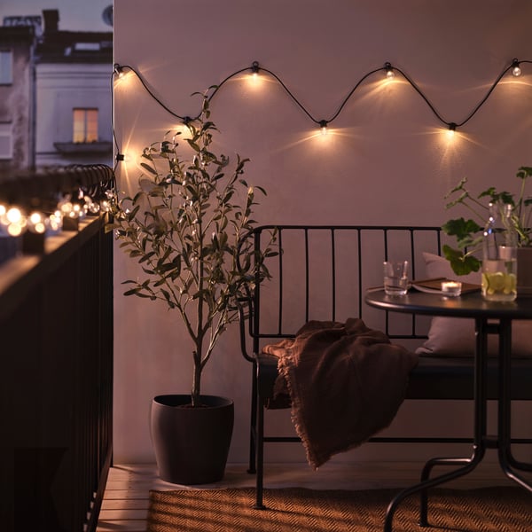 An outdoor black UTSUND LED lighting chain with 24 bulbs