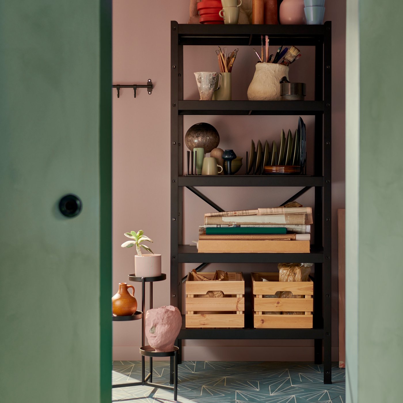 An in/outdoor black OLIVBLAD plant stand