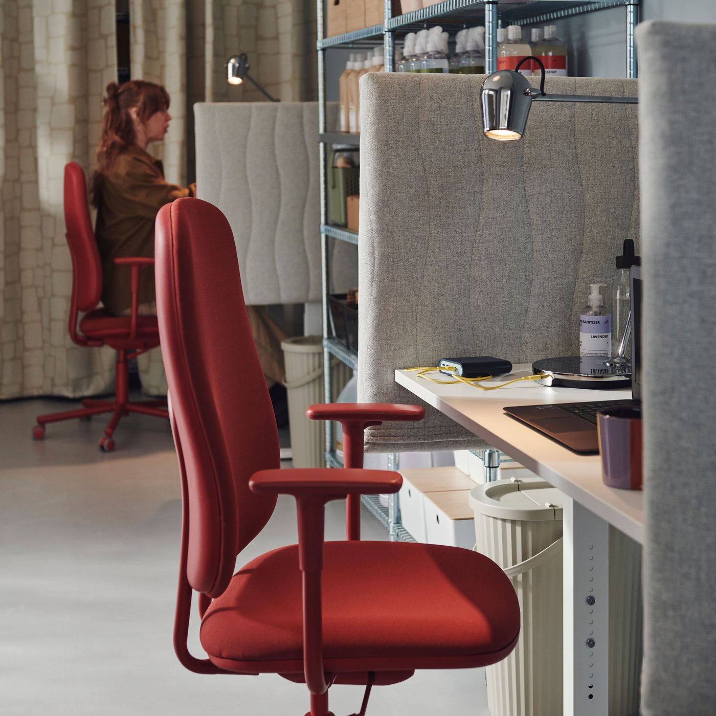 A red chair at a desk
