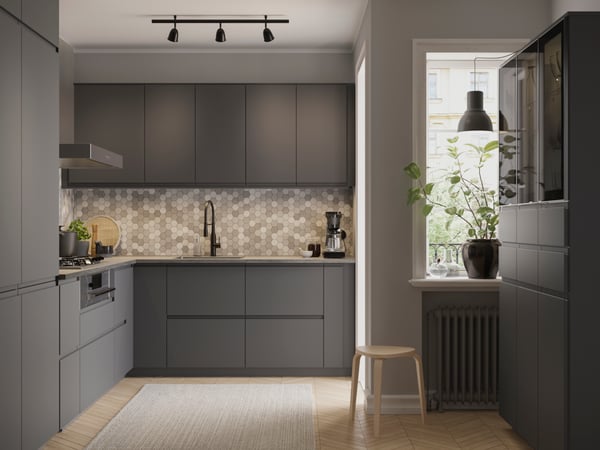 A black SKURUP ceiling track, 3-spots in the kitchen