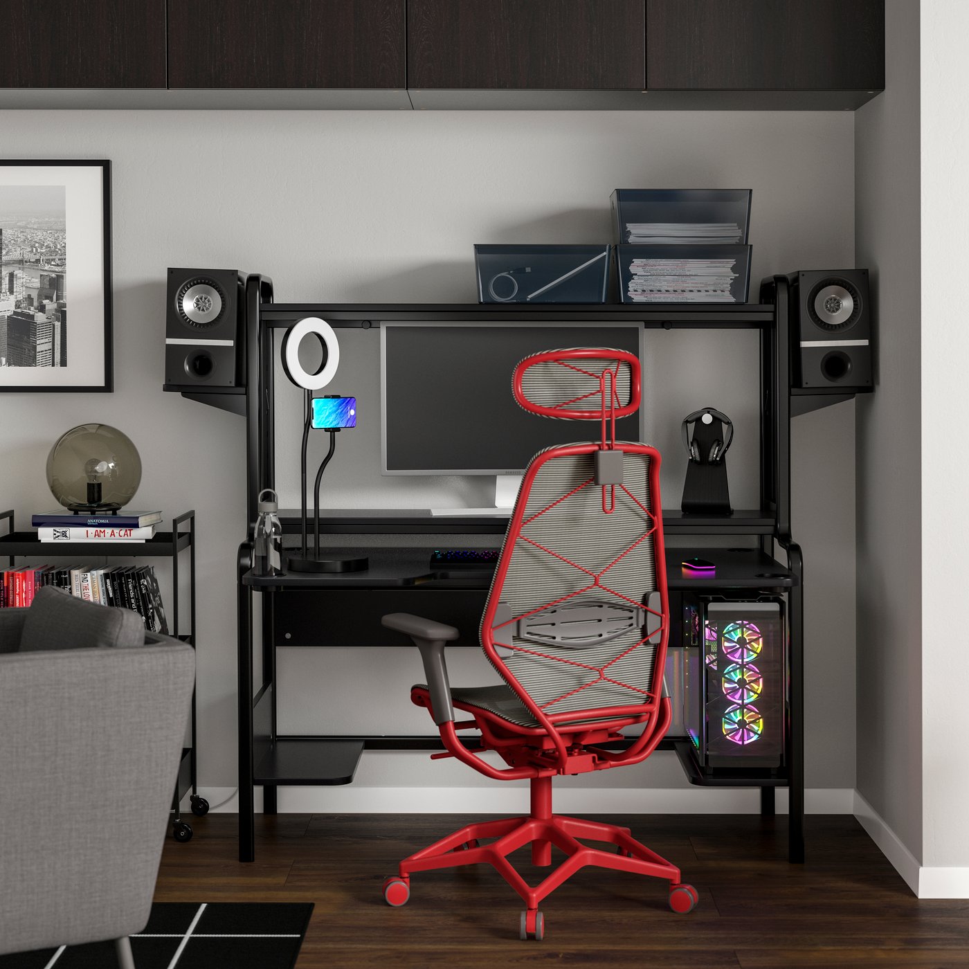 A black grey/red STYRSPEL gaming desk and chair