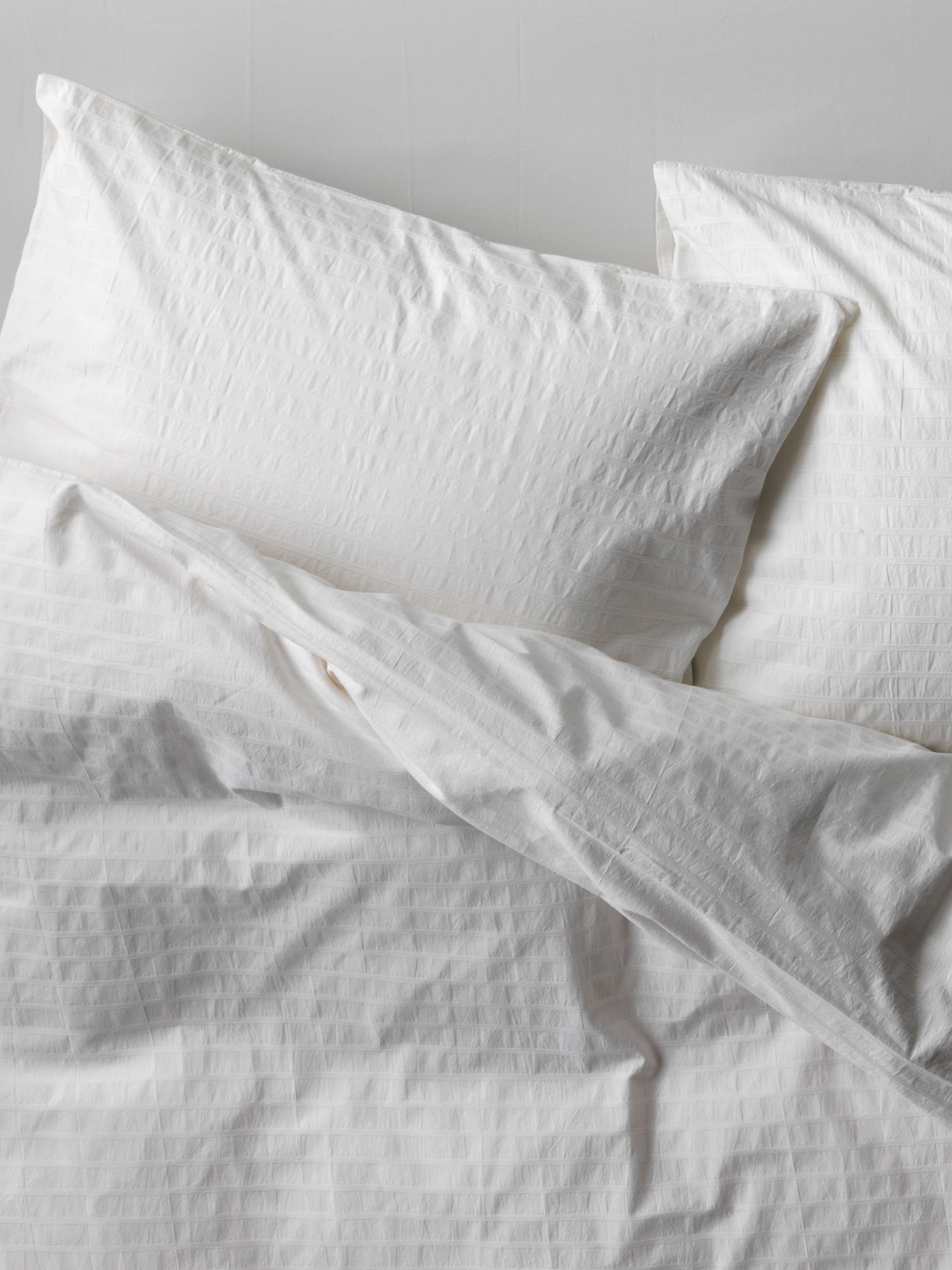 A white OFELIA VASS duvet cover and pillowcase