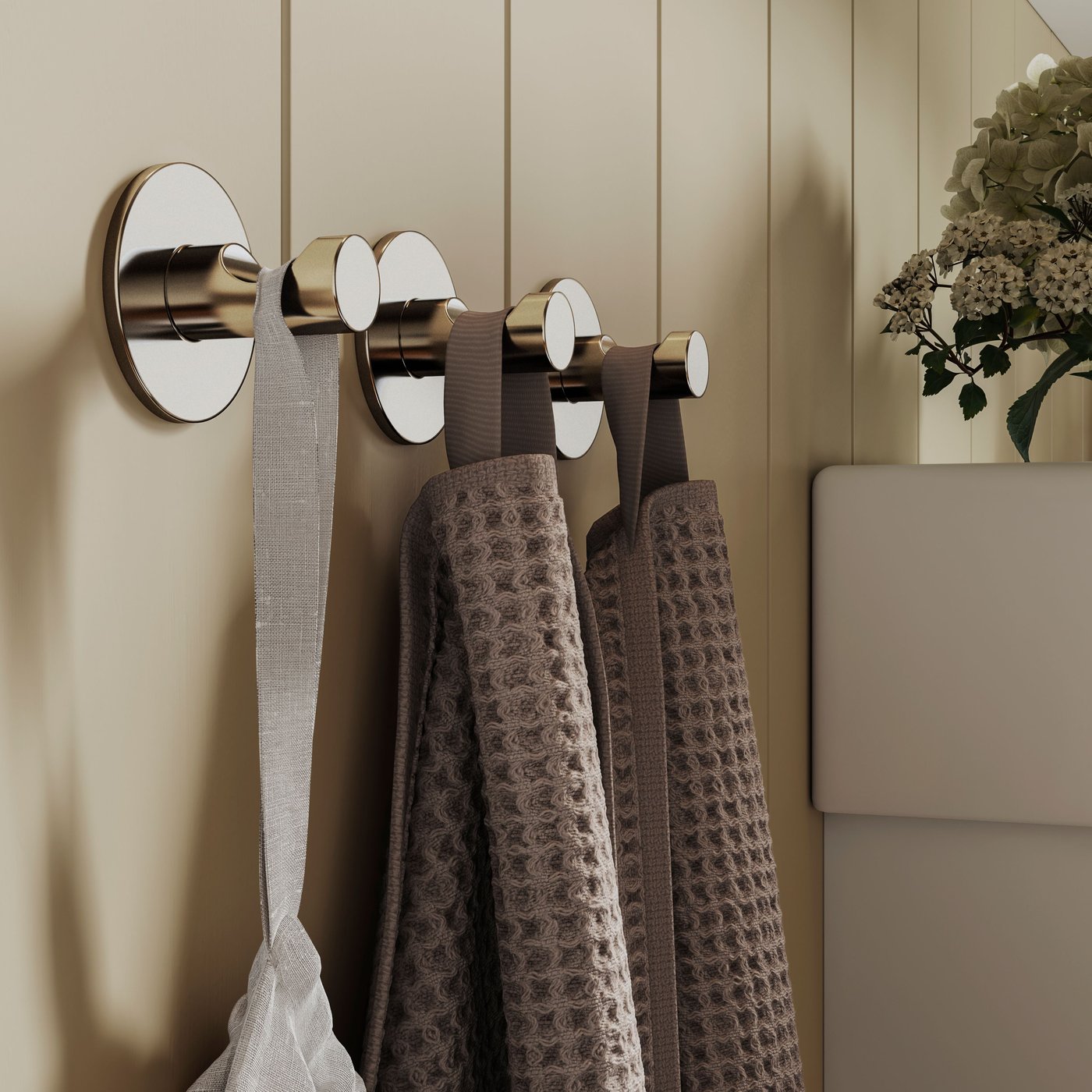 A light grey/brown VALLASÅN hand towel