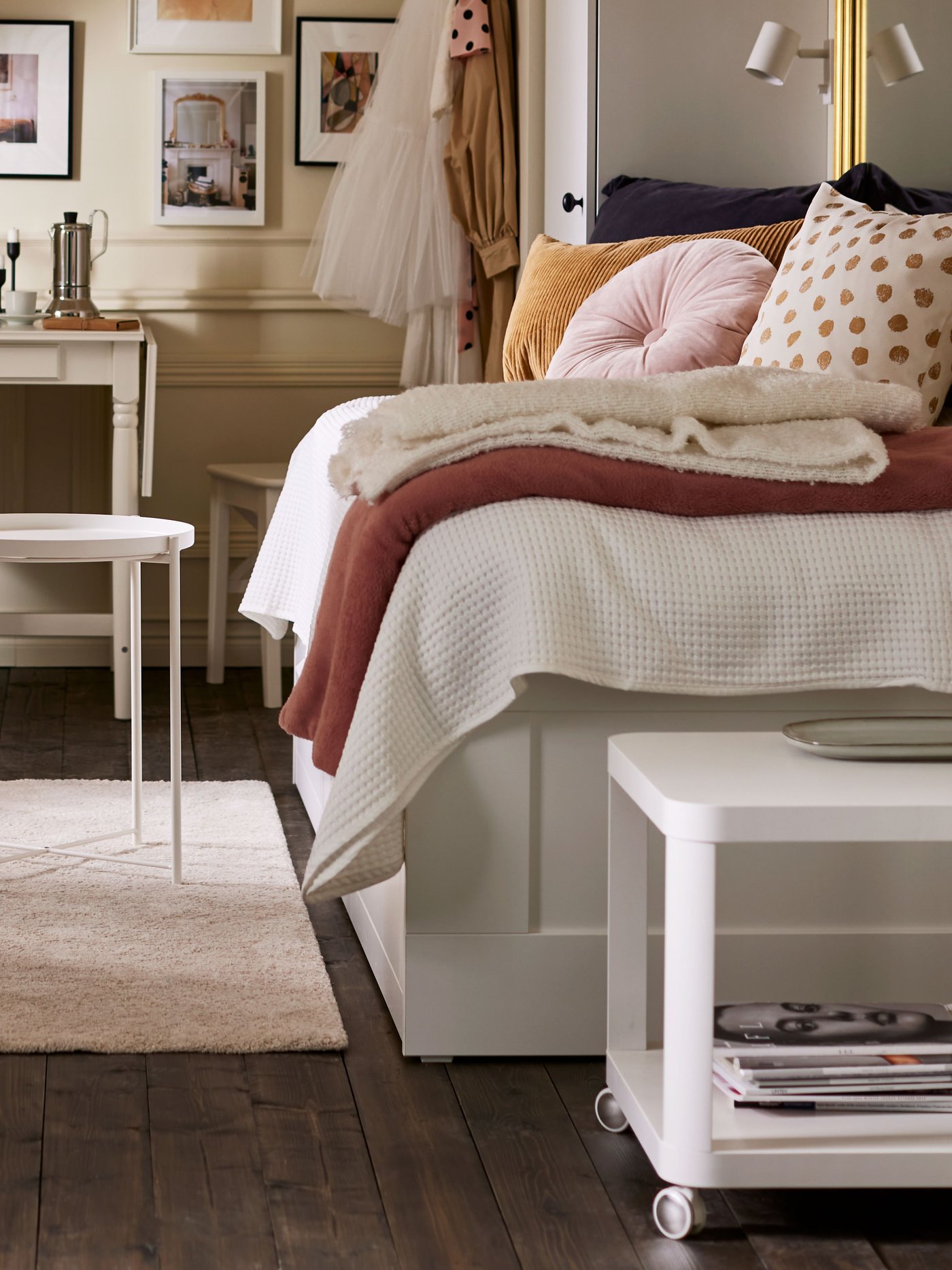 A white TINGBY side table on castors in the bedroom