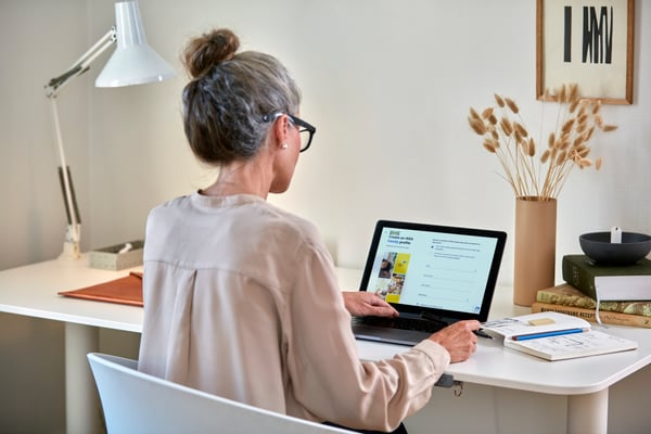 Person sitting in front of a laptop