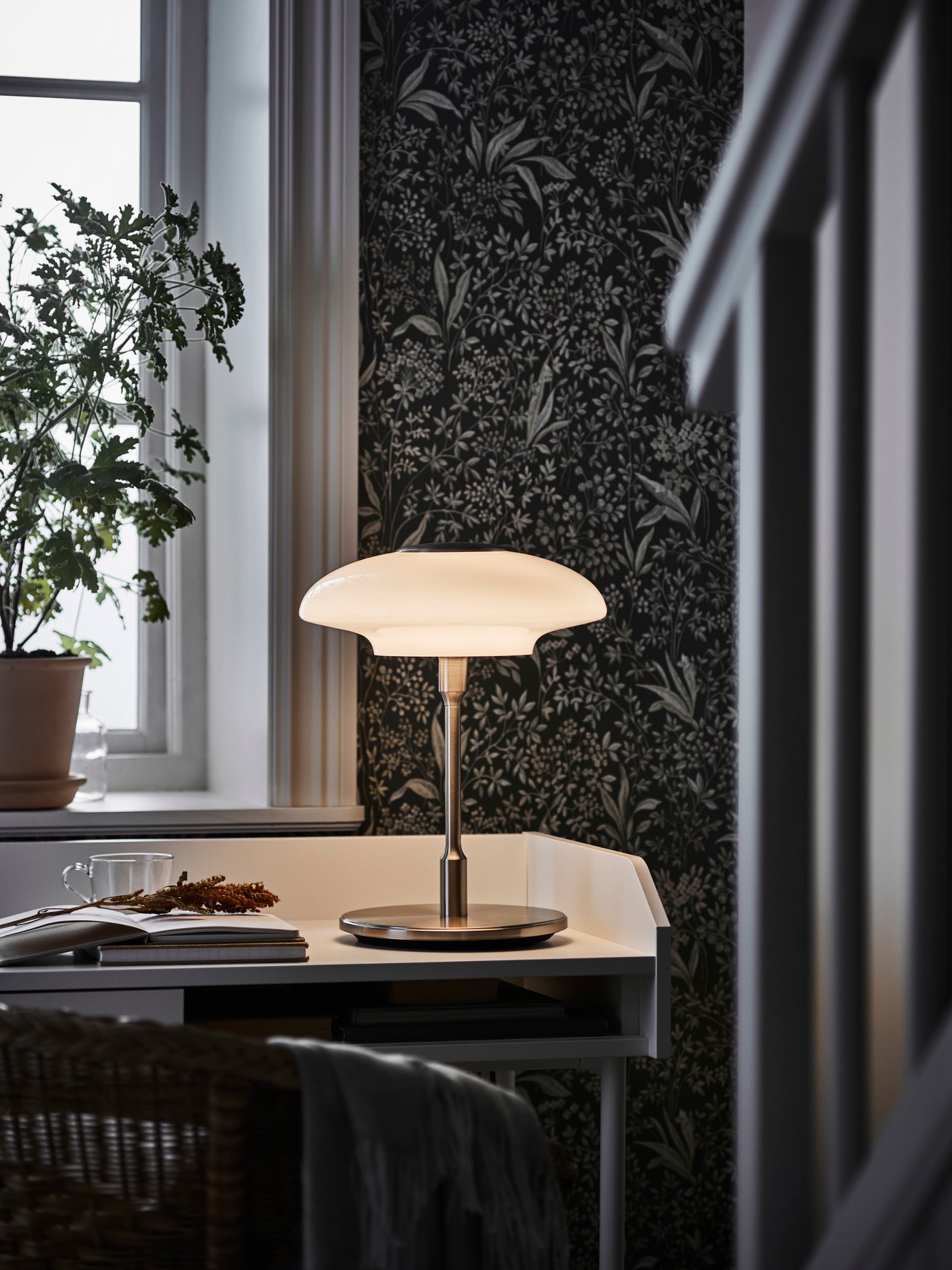 A nickel-plated/opal white glass TÄLLBYN table lamp
