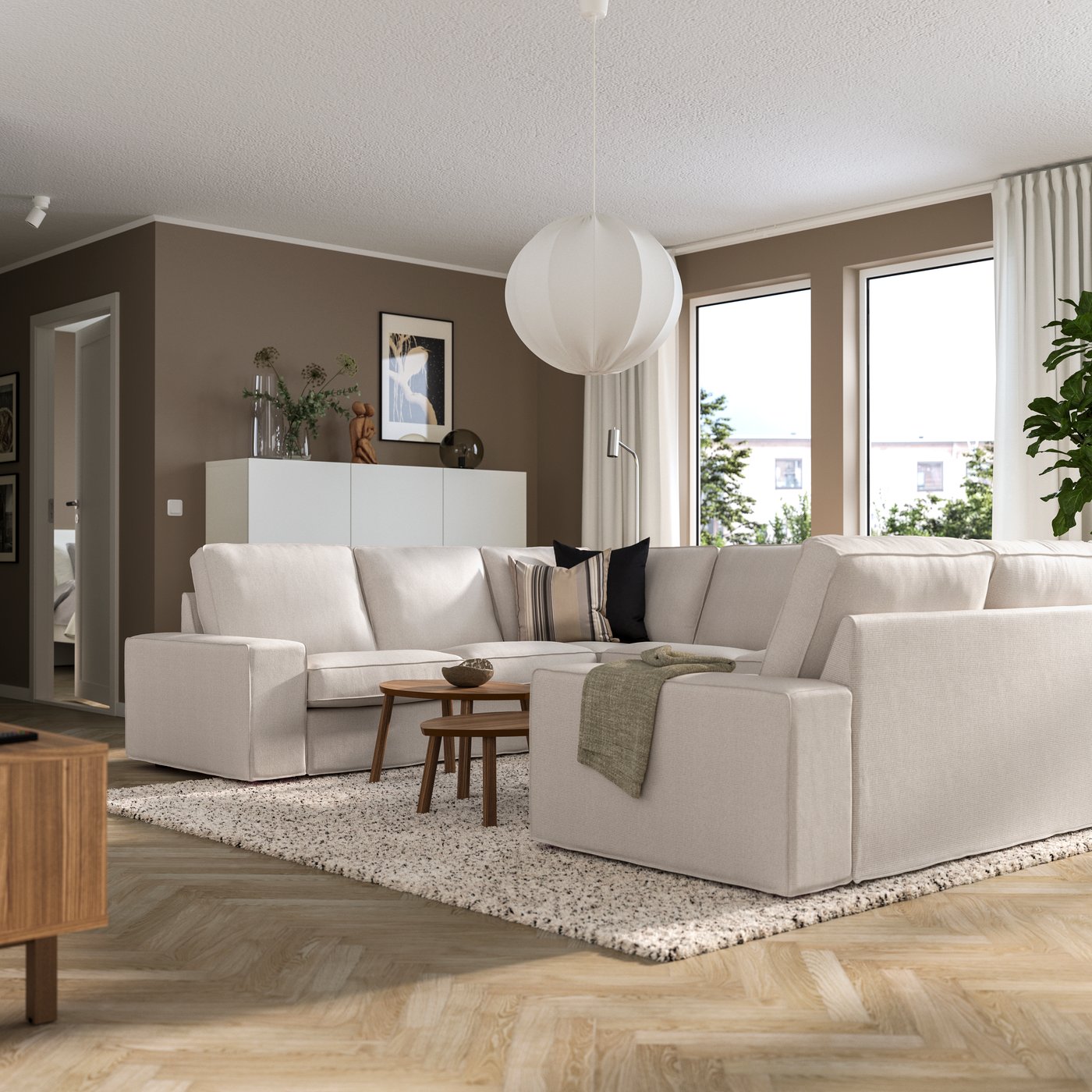 A Tresund light beige KIVIK u-shaped sofa, 6 seat in the living room