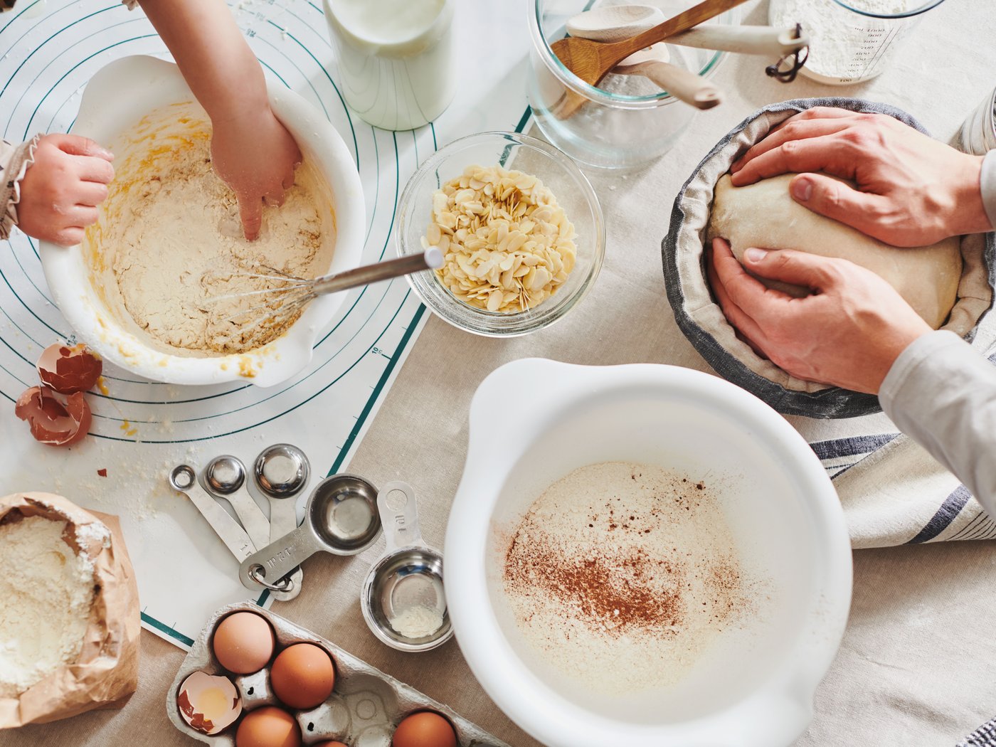 A view from top on dough preparing in different mixing bowls.