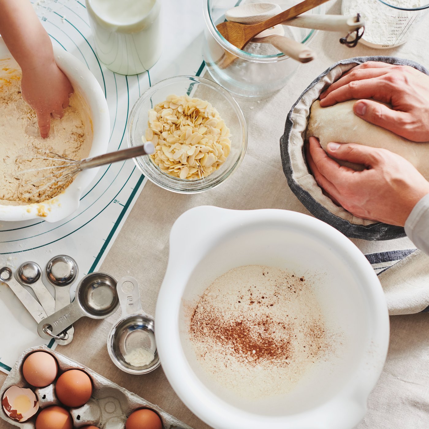A view from top on dough preparing in different mixing bowls.