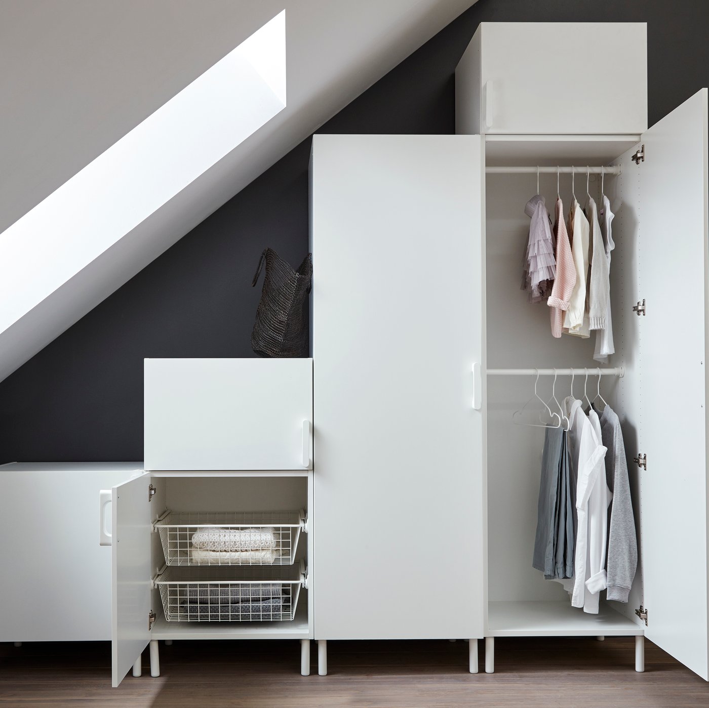 Open PLATSA wardrobe solution under a sloped ceiling.