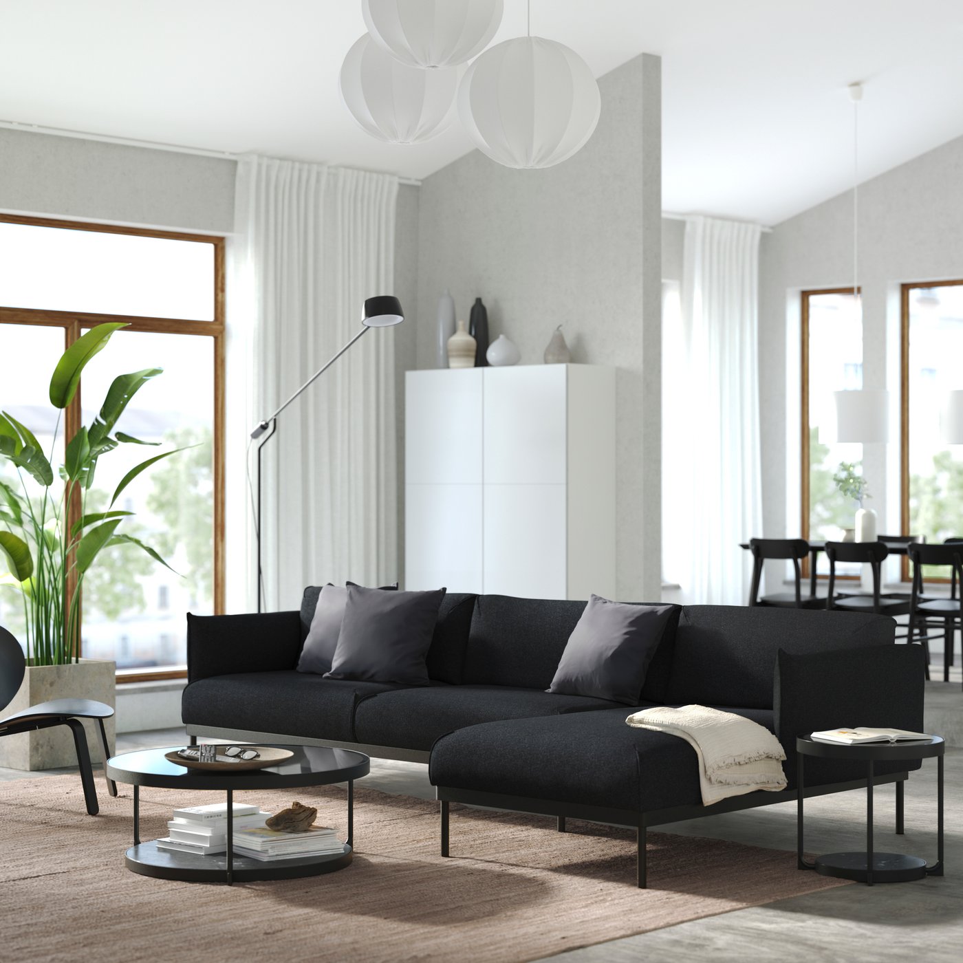 A Gunnared black/grey ÄPPLARYD 4-seat sofa with chaise longue