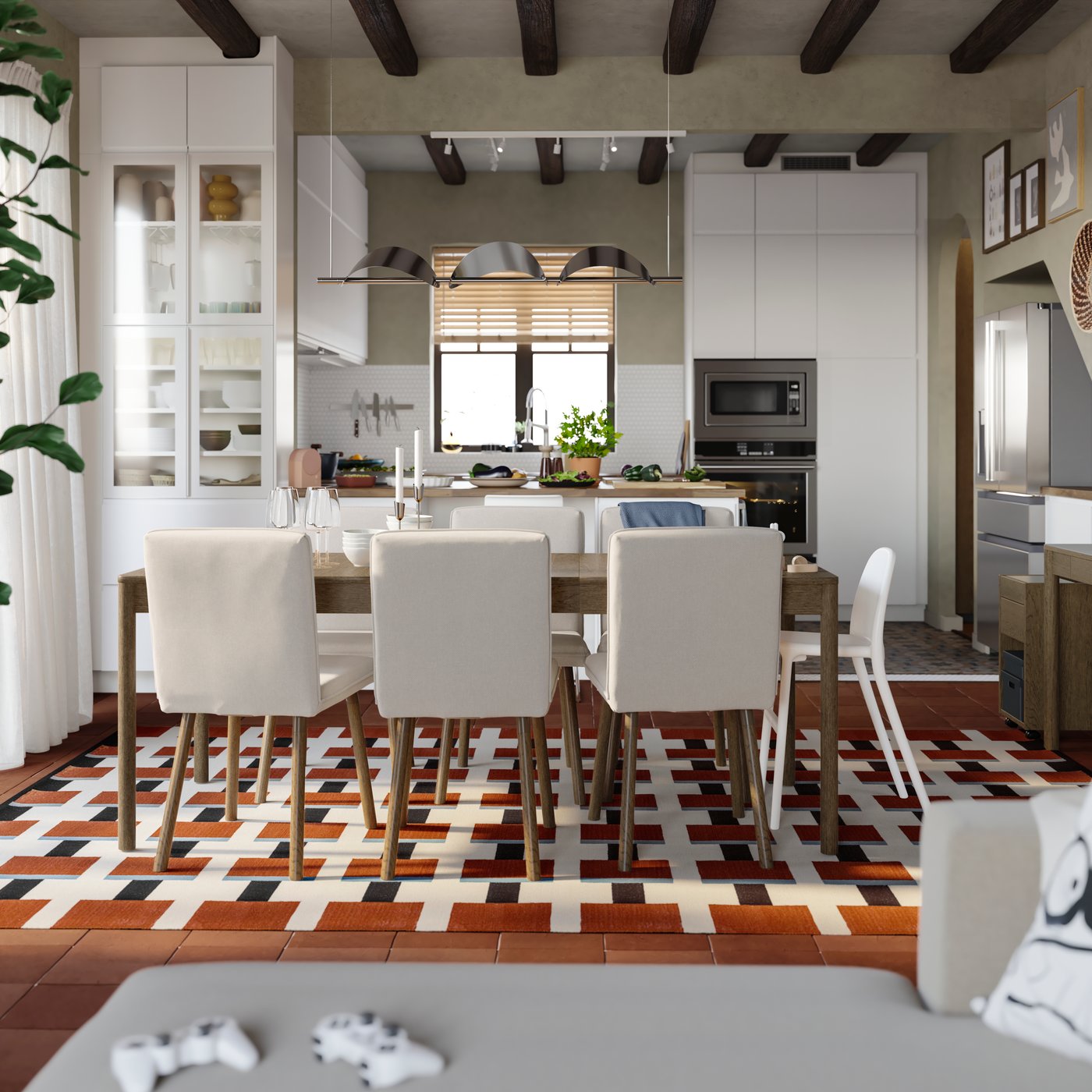 A dining room with a TONSTAD extendable table in brown stained oak veneer has a kitchen with a peninsula in the background.
