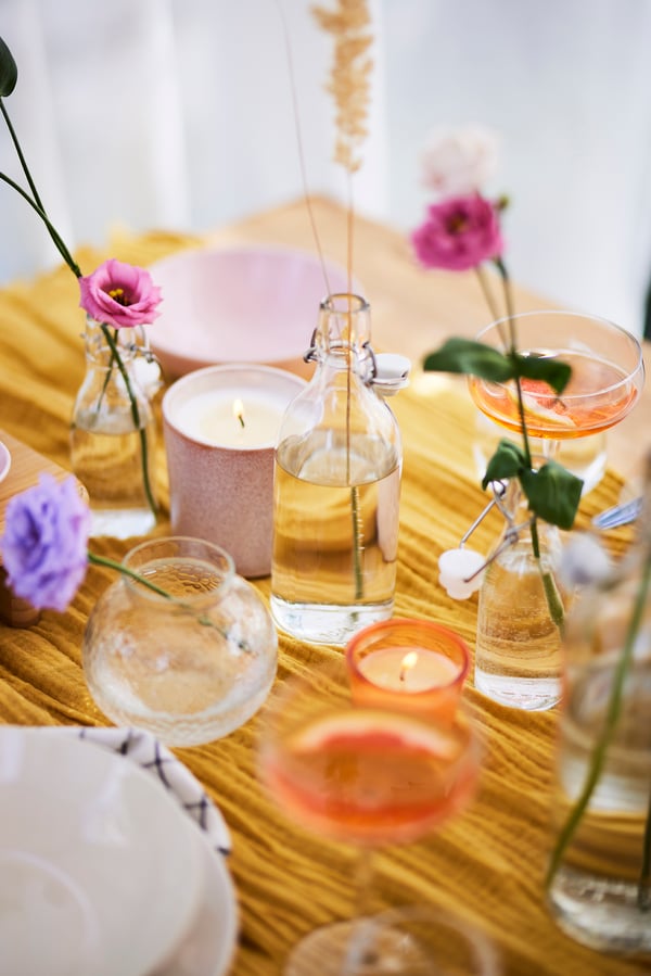 A table set with flowers in summer colours.