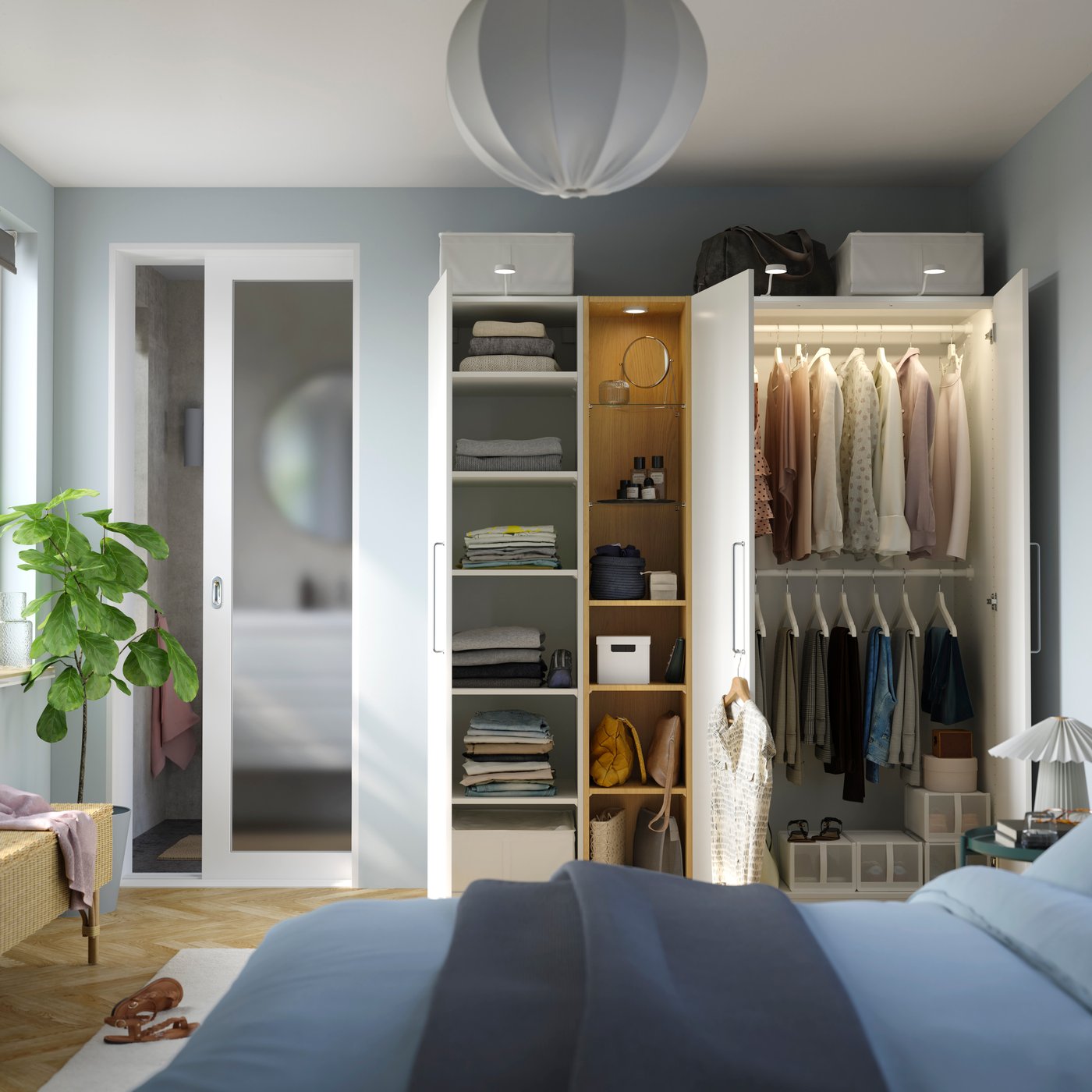 A white white/oak effect PAX wardrobe combination in the bedroom