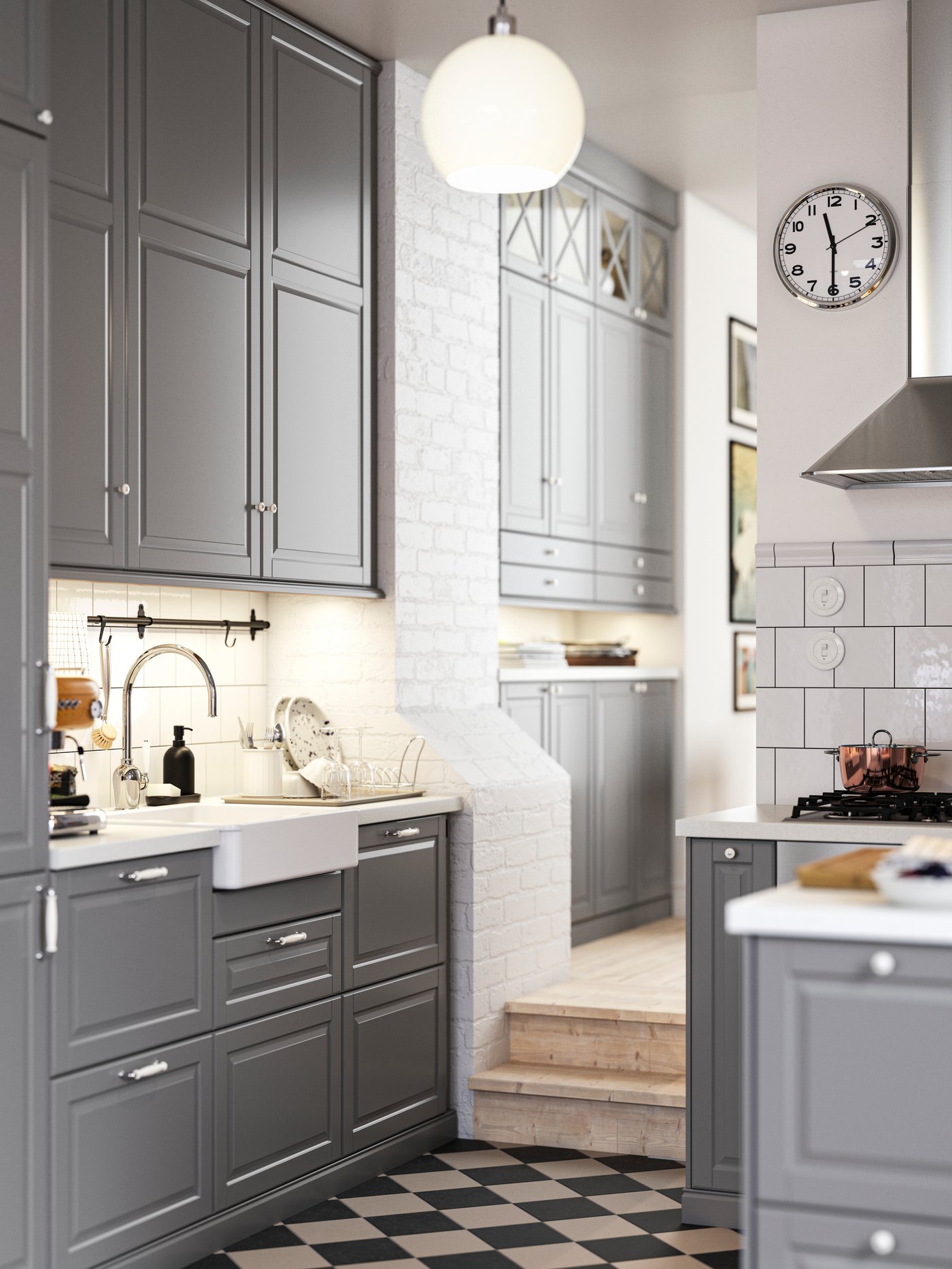 A kitchen with grey BODBYN fronts and a white HAVSEN sink bowl with visible front leading into a hallway with more cabinets.