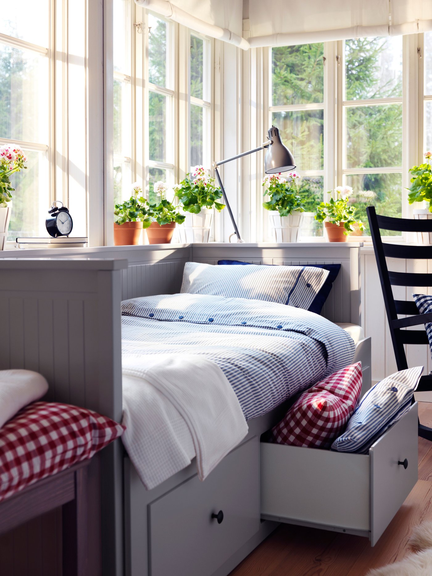 A grey HEMNES day-bed frame with 3 drawers