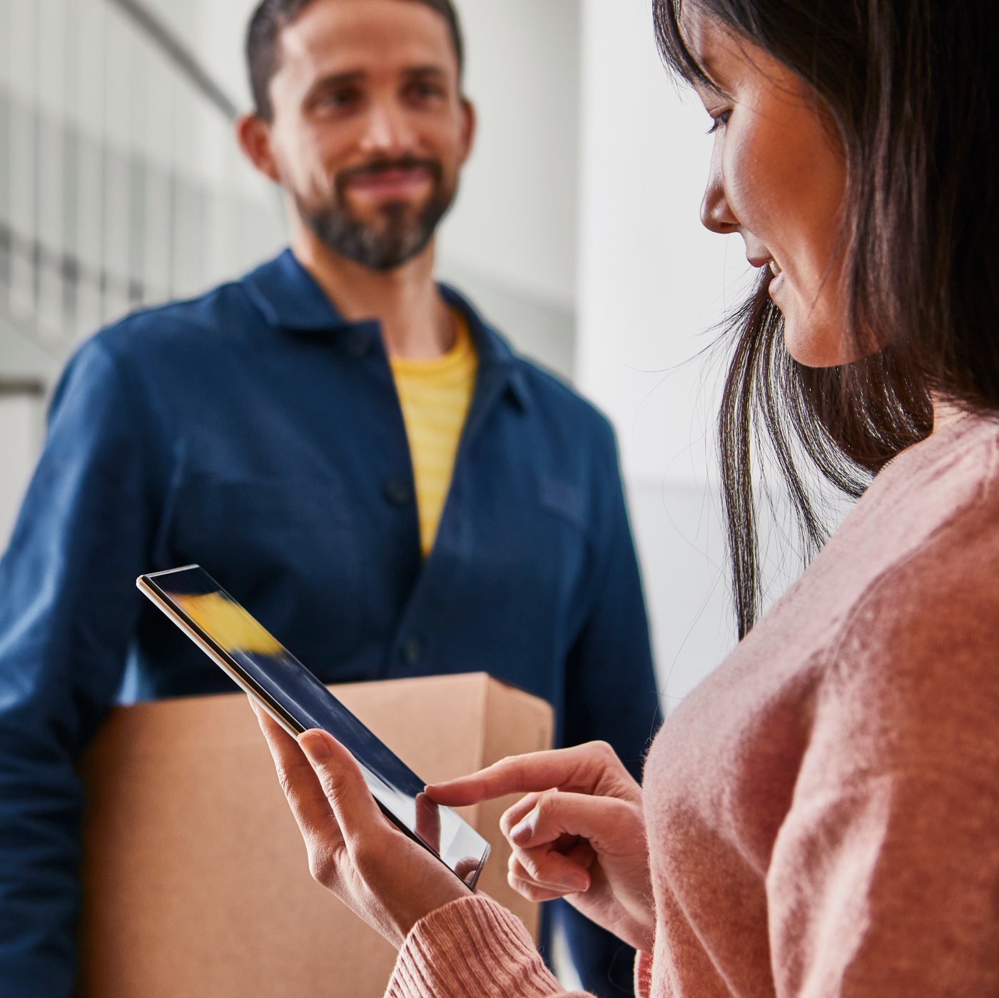 IKEA coworker delivering a package to a woman
