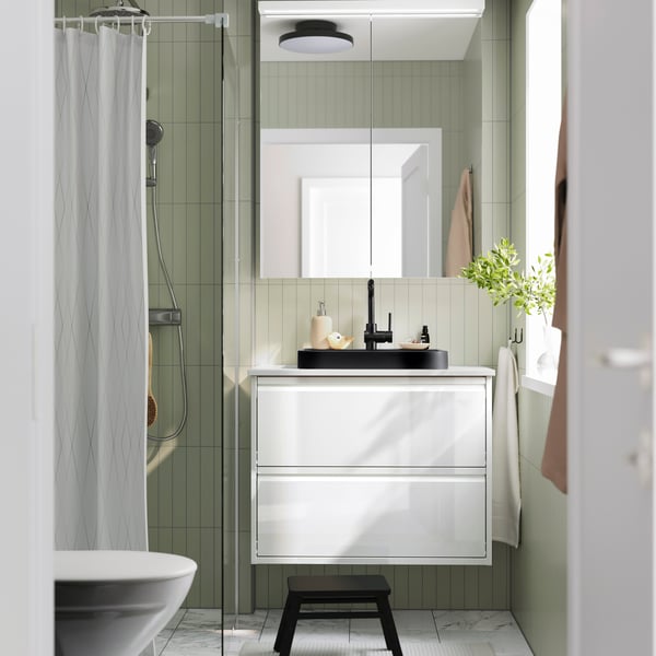 A black BACKSJÖN semi-recessed wash-basin w watr trp in the bathroom