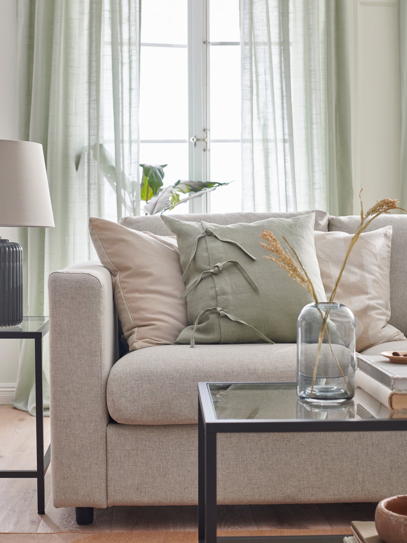 A beige RÖDASK cushion cover in the living room