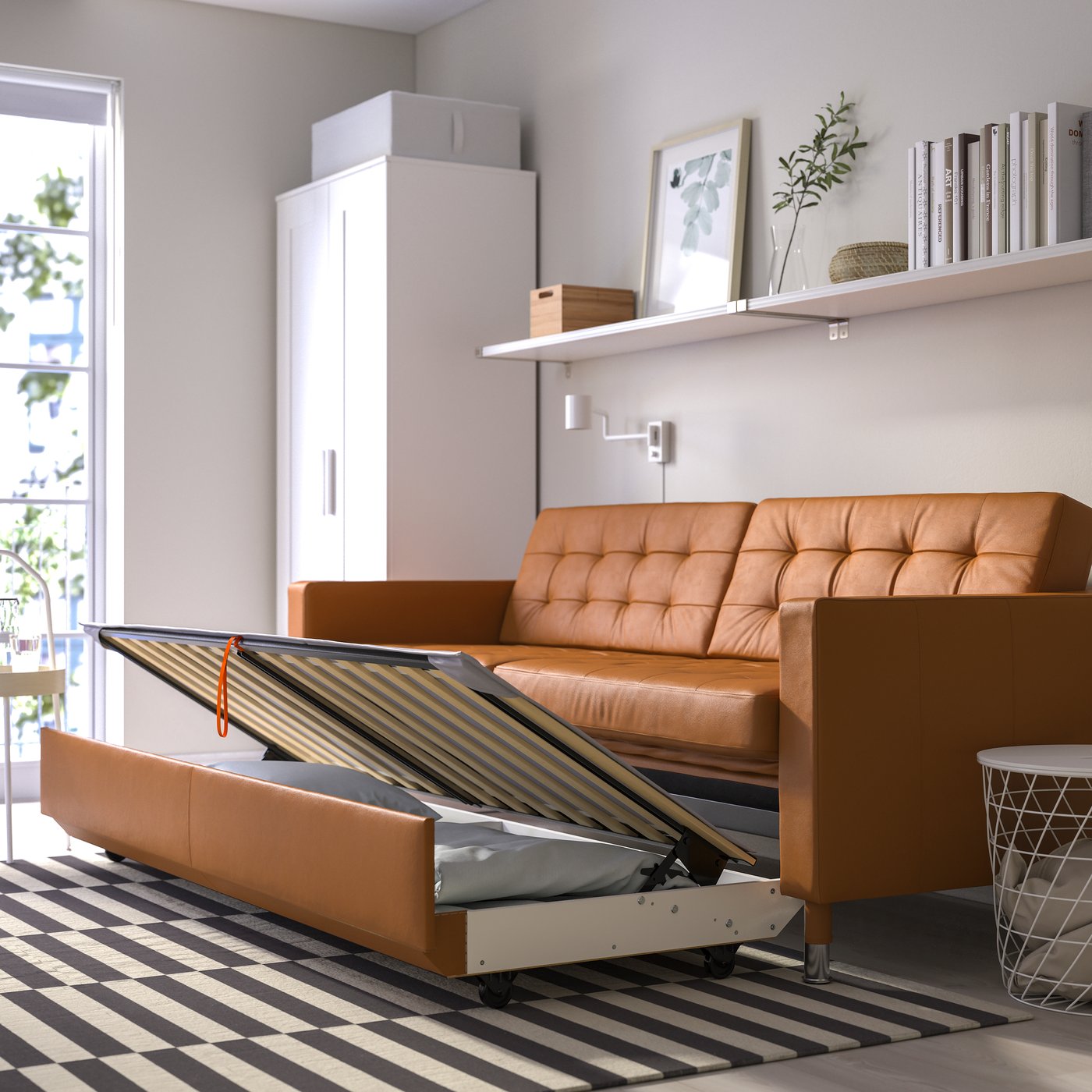 A Grann/Bomstad golden-brown/metal LANDSKRONA 3-seat sofa-bed in the living room