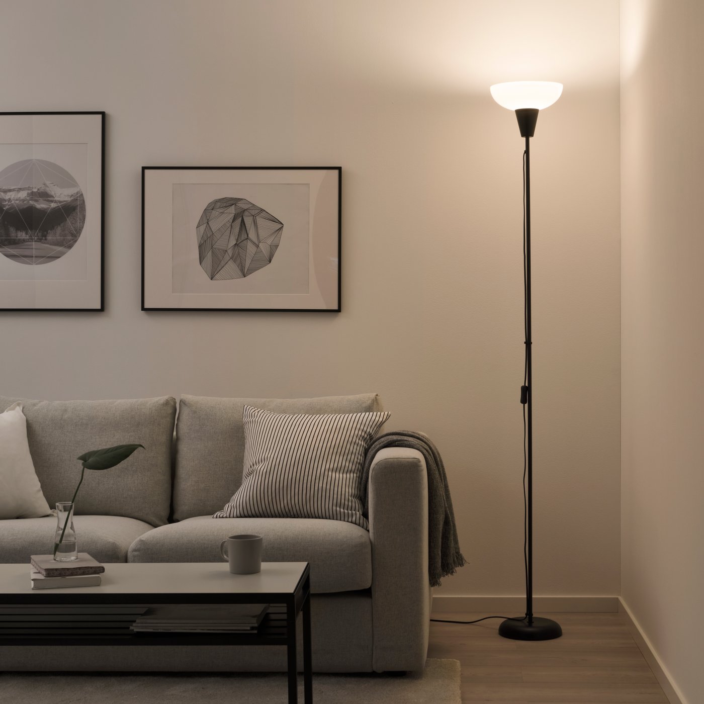 A black/white TÅGARP floor uplighter